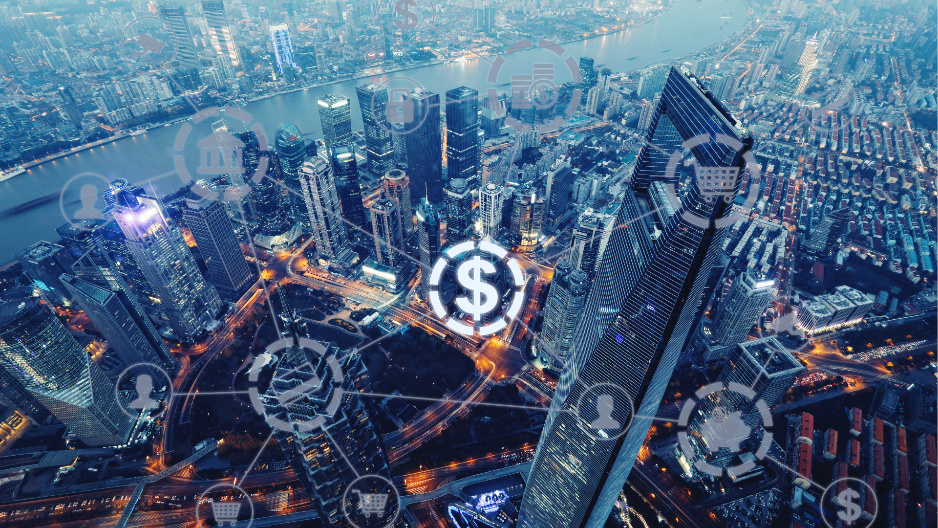 vista aérea noturna de uma grande cidade com arranha-céus iluminados e um rio ao fundo. Sobre a imagem, grafismos digitais semi-translúcidos representam conectividade financeira — ícones de cifrão, cadeado, banco, carrinho de compras e silhuetas humanas unidos por linhas, simulando uma rede interligada de economia digital e transações.